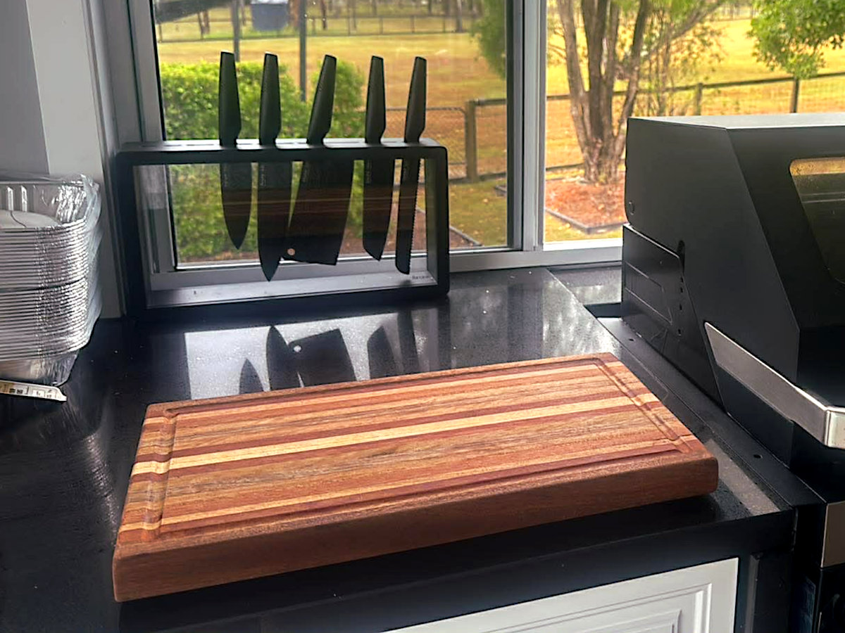 Customer outdoor BBQ setup with hardwood chopping board