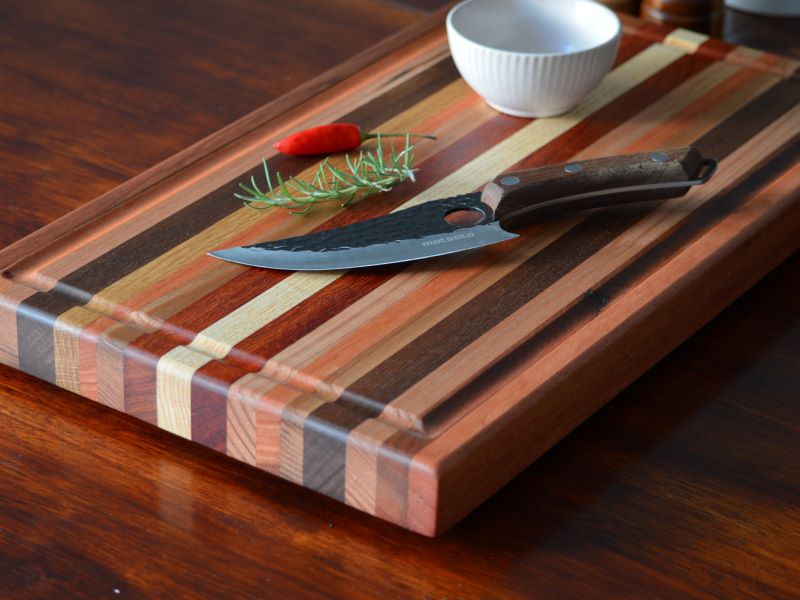 Board close on table with knife